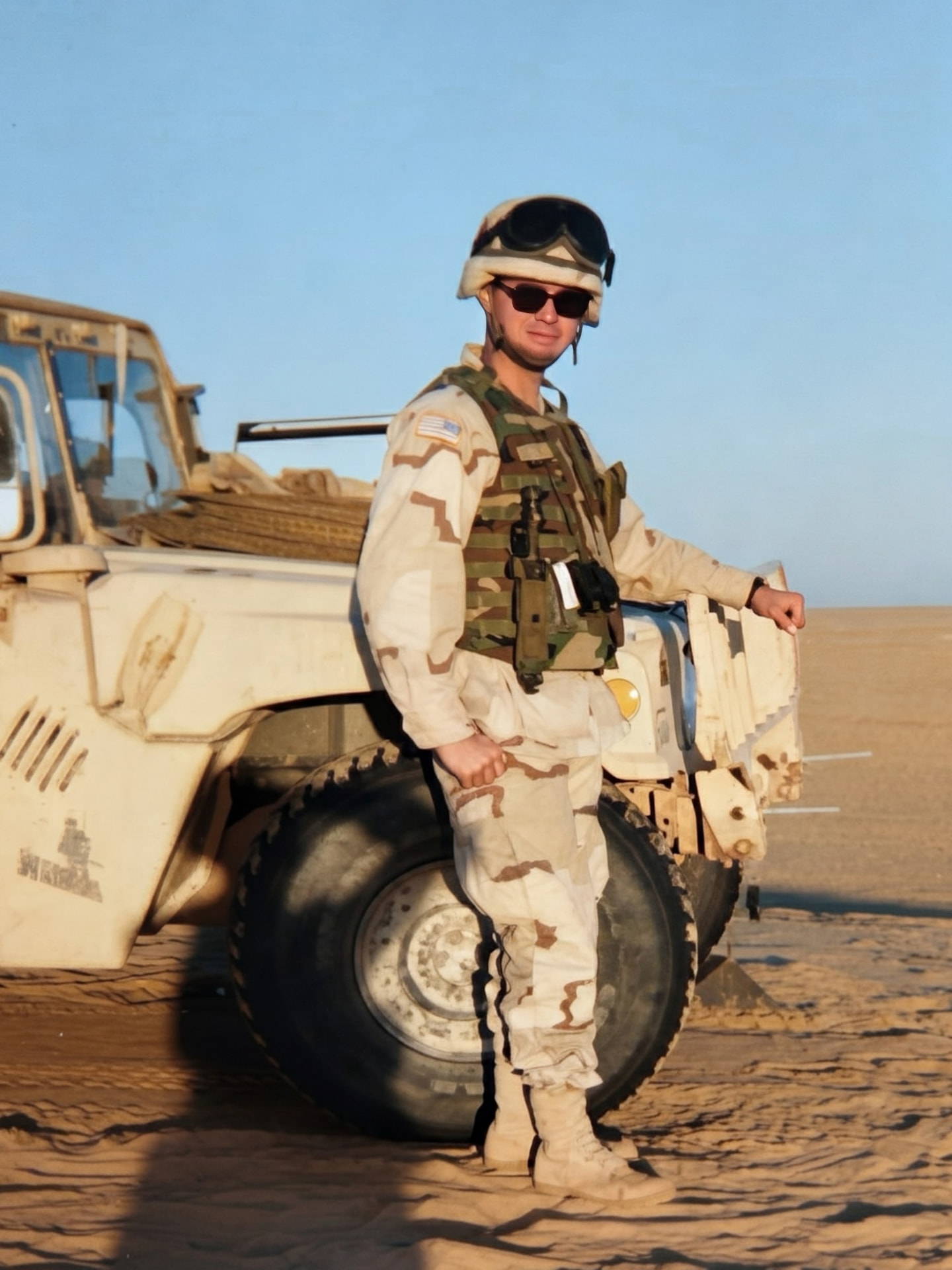 David F. Zapata in uniform beside a Humvee in the desert